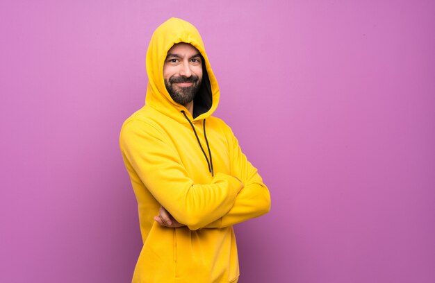 Happy Handsome man with yellow sweatshirt