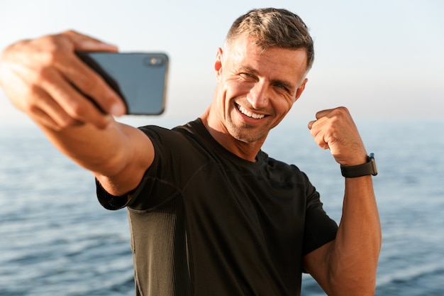 Happy handsome shirtless sportsman