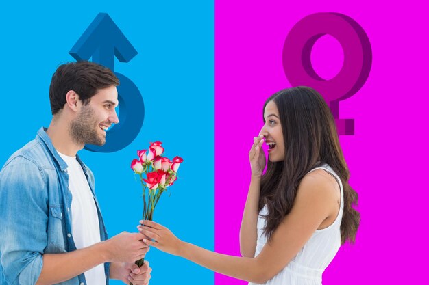 Happy hipster giving his girlfriend roses against pink and blue