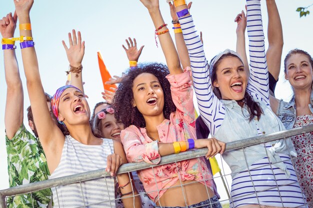 Happy hipsters listening to live music