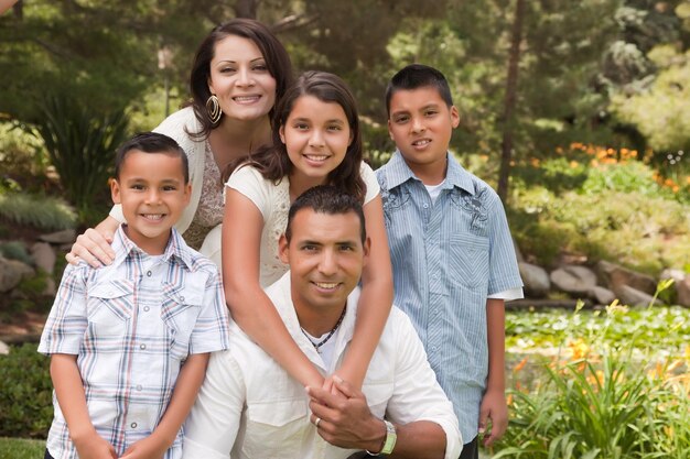 Happy Hispanic Family Portrait In the Park