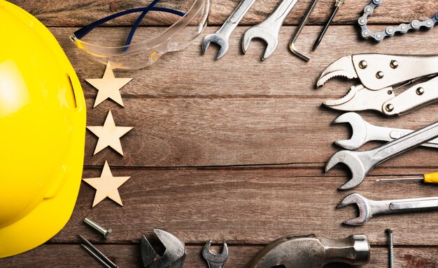 Happy holiday labor day, different kinds wrenches on wooden desk table