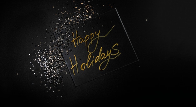 Happy Holidays Beautiful sparkling Golden Happy Holidays on a black background