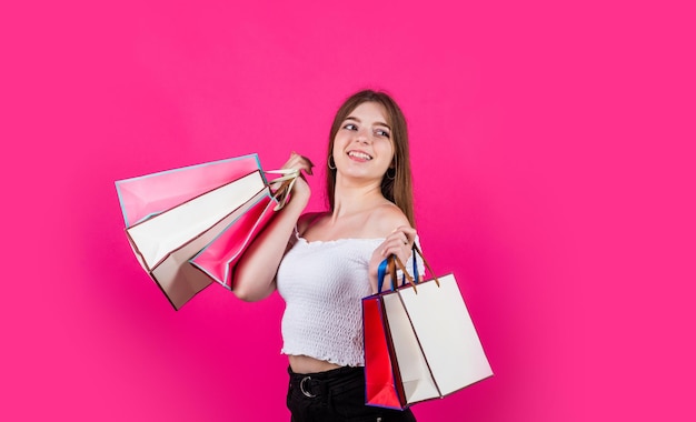 Happy holidays kid holding many shopping bags prepare for holidays buy gift and presents nice purchase flash sale giveaway happy childhood cheerful girl after successful shopping