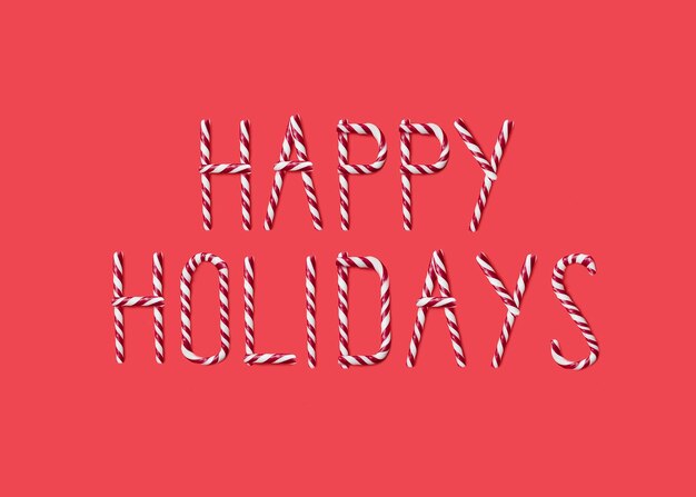 happy holidays made from sweet caramel canes candies on red background