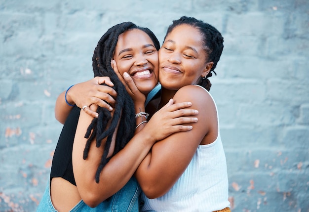 Happy hug and black friends in the city while on summer vacation together in south africa Happiness smile and african women embracing bonding with affection on the urban street on holiday