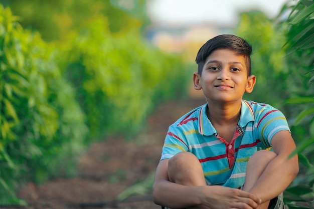 Happy indian child playing at ground