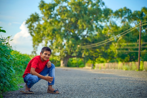 Happy indian child playing at ground