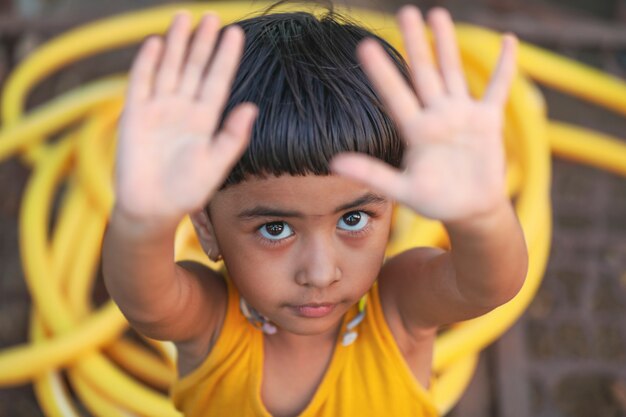 Happy indian girl child playing at ground