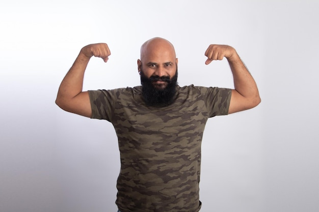 happy Indian Healthy middle aged man showing his arms and biceps