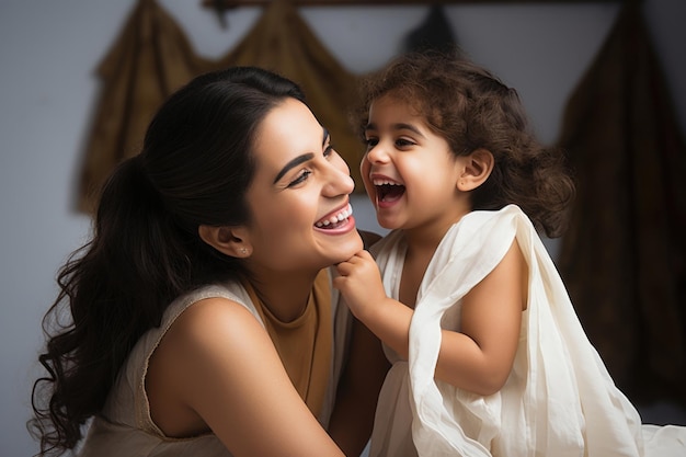 Happy Indian mother and cheerful daughter at home