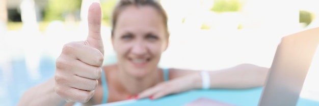 Happy joyful woman show thumbs up on camera relaxed person on summer holiday