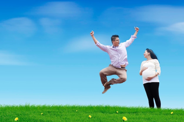 Happy jumping father