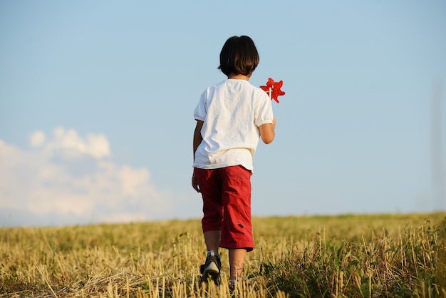 Happy kid on beautiful field