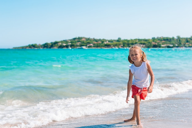 Happy kid by the sea