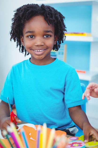 Happy kid enjoying arts and crafts painting