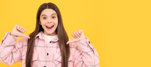 Happy kid girl wear pink checkered shirt pointing fingers on herself selfish Child face horizontal poster teenager girl isolated portrait banner with copy space