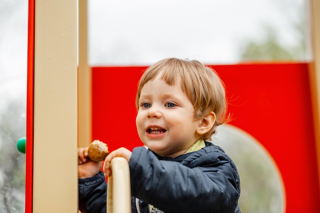 Happy kid having fun on playground portrait of happy child