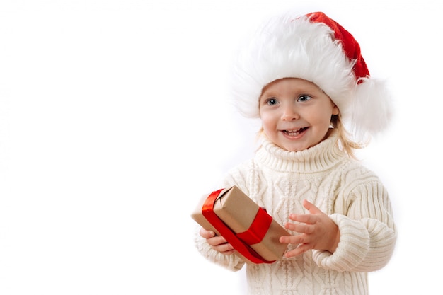 Happy Kid In Santa Hat Hold Christmas Gift Box