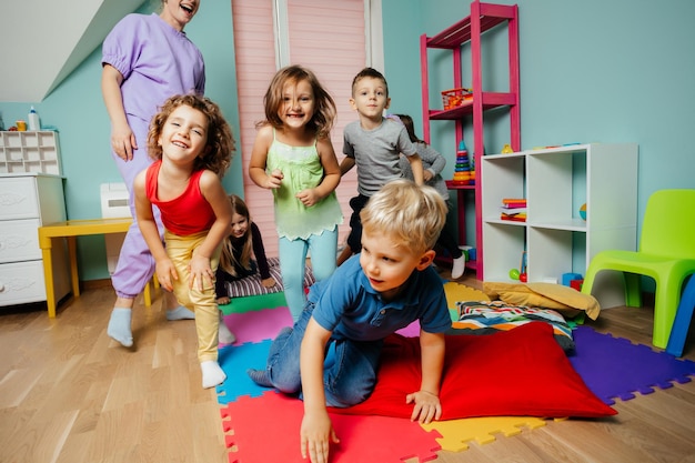 Happy kids actively playing at the daycare