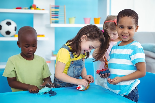 Happy kids enjoying arts and crafts together