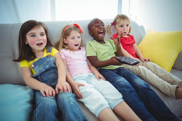 Happy kids laughing while sitting down