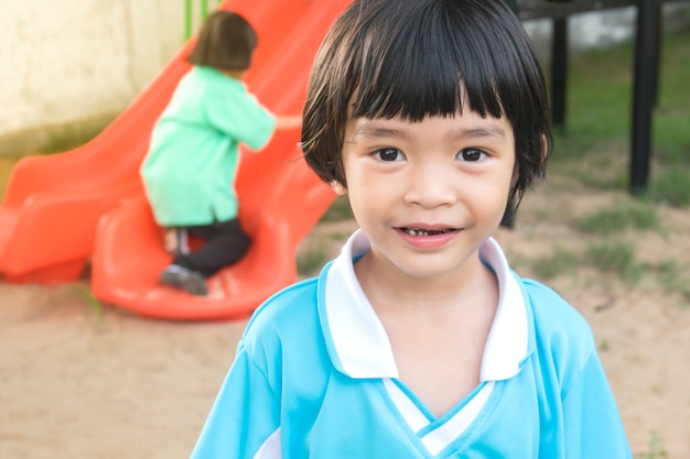 Happy kids smile in playground