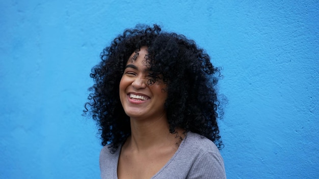 A happy latin African woman laughing and smiling