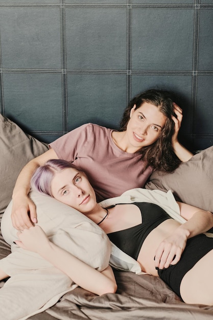 Happy lesbians in bedroom