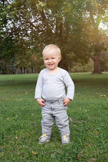 Happy little baby boy in park outdoor