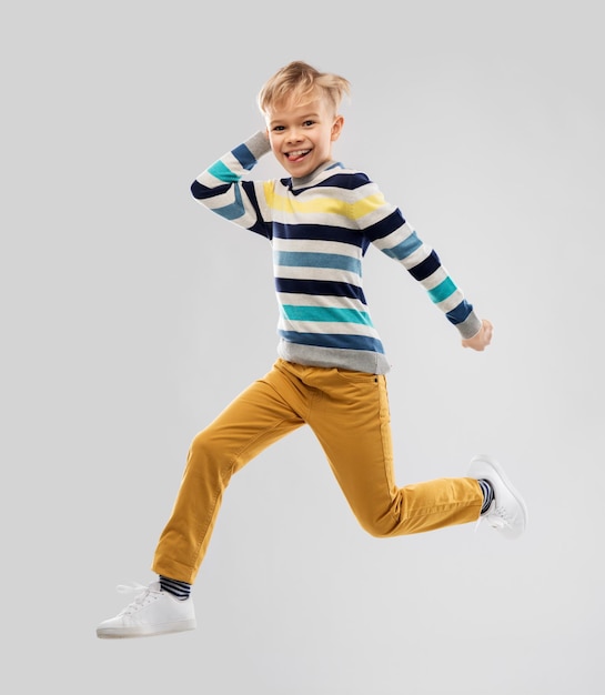 happy little boy jumping and having fun