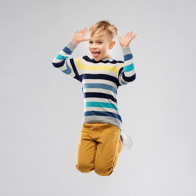 happy little boy jumping and having fun