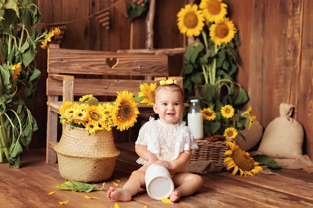 Happy little boy in a sunflower decor