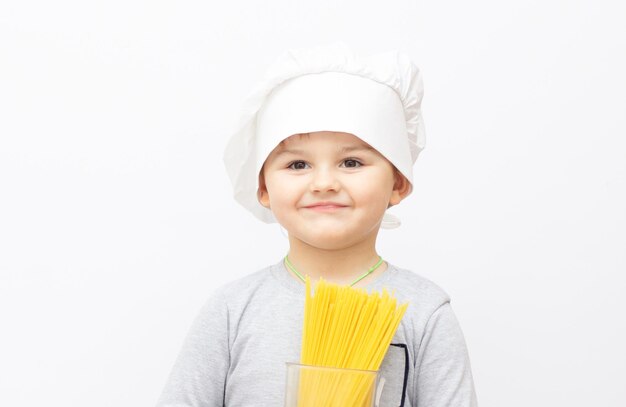 Happy little chef on white background.