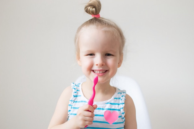 Happy Little Girl Brushing Her Teeth, Pink Toothbrush, Dental Hygiene, Morning Night Healthy Concept Lifestyle