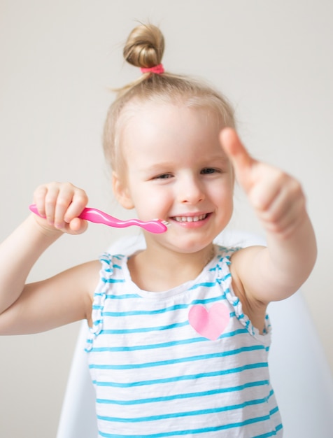 Happy Little Girl Brushing Her Teeth, Pink Toothbrush, Dental Hygiene, Morning Night Healthy Concept Lifestyle