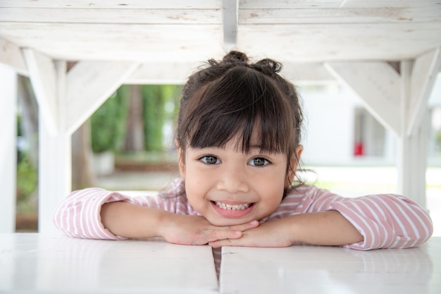 Happy little girl having fun at home