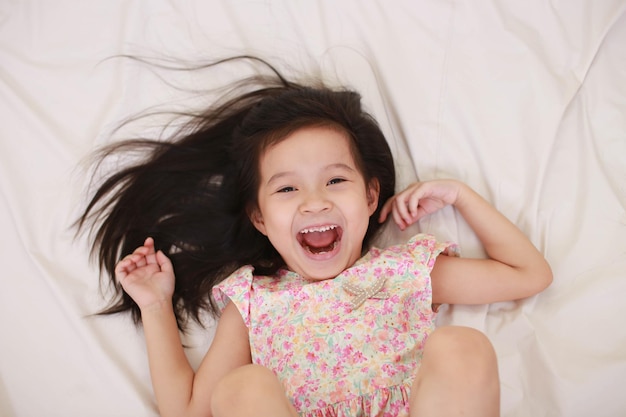 Happy little girl isolated on white background