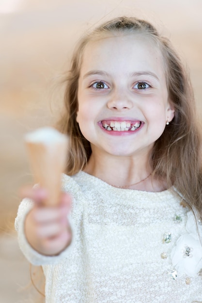 Happy little girl kid with yummy ice cream