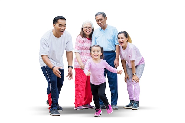 Photo happy little girl playing with her family on studio