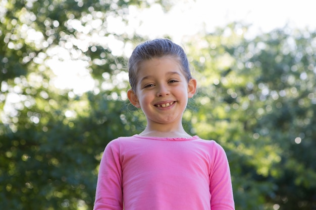 Happy little girl smiling at camera