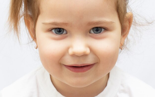 Happy little girl a on white background