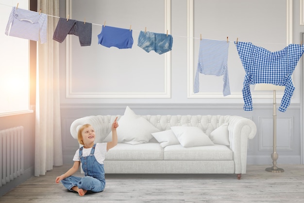 Happy little girl with bucket of washed clothes. Mixed media