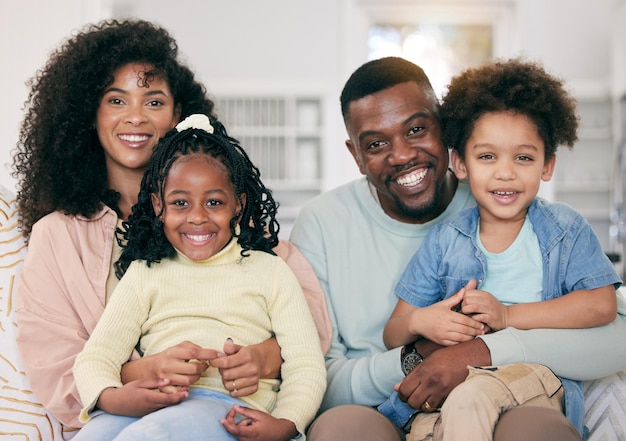 Photo happy love and portrait of a black family in the living room sitting relaxing and bonding together happiness smile and young african man and woman resting with their children on a sofa at home