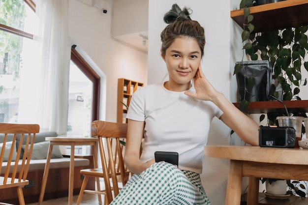 Happy lovely girl relaxing in the cafe concept of happy single life