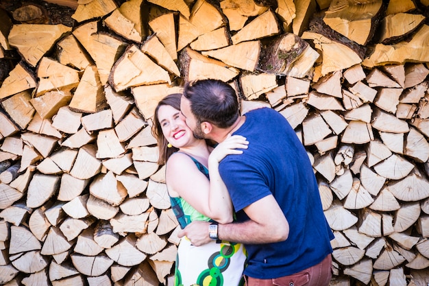 Happy lovers on wooden background