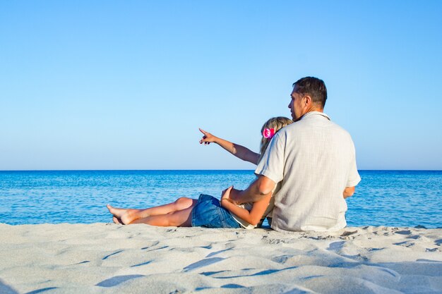 Happy loving couple by the sea in the nature