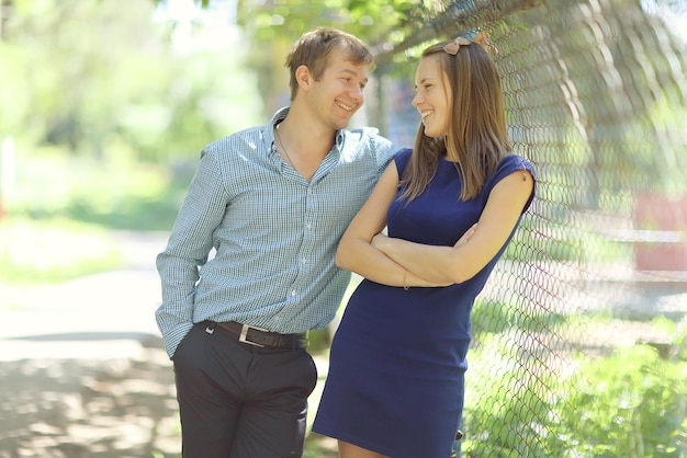 Happy loving couple in a city park young