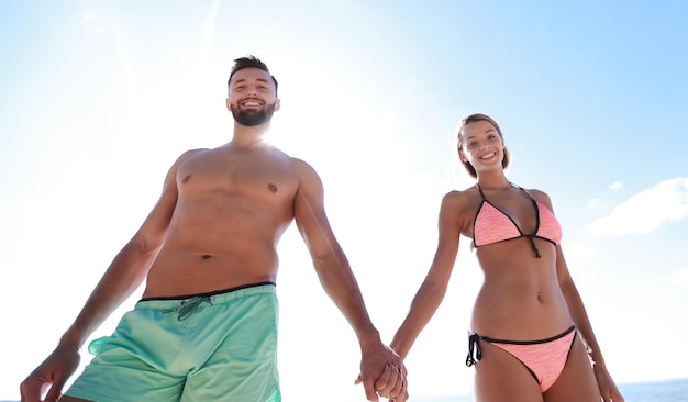 Happy loving couple enjoy tropical beach