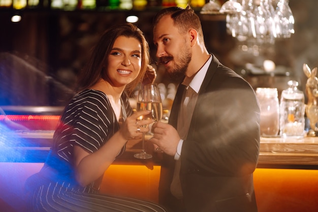 Happy loving couple enjoying having drinks together Party celebration Romantic evening